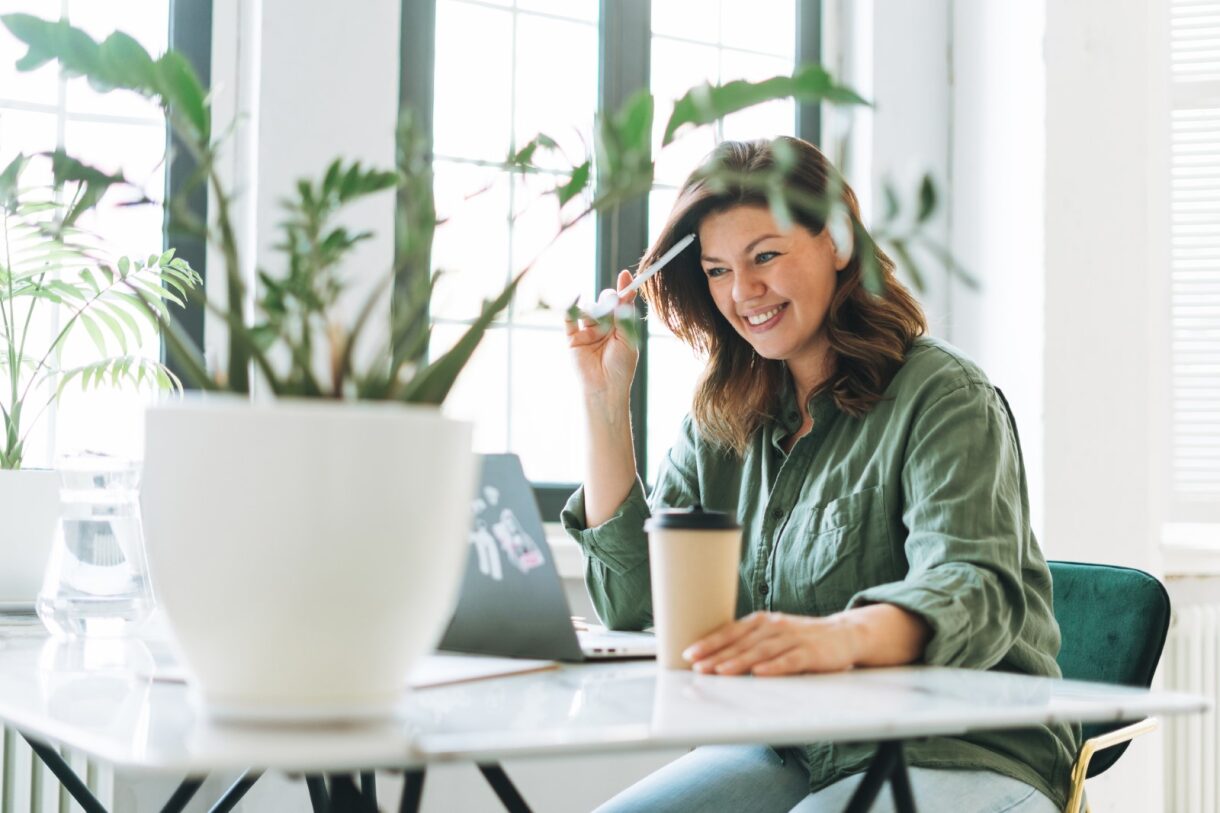 A woman working on her laptop.